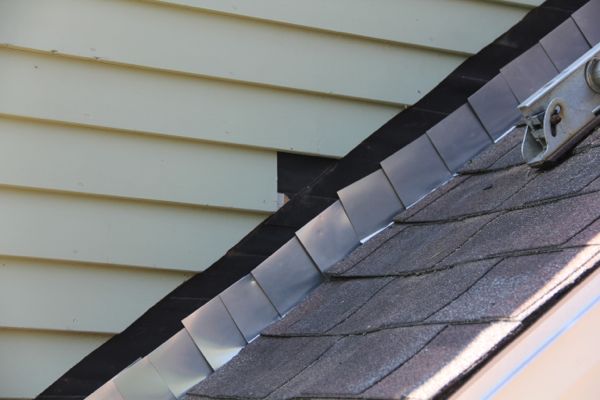 how to install step flashing on existing roof overhang